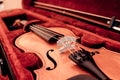 Musical instruments. Close up violin and bow in open dark red case