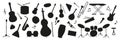 Musical instruments and notes in a creative black silhouette arrangement Royalty Free Stock Photo