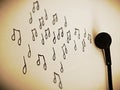 Picture of musical notes drew in white background with earphone