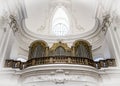 A musical organ in a fabulous white interior of a baroque church of Kollegienkirche Collegiate Church in Salzburg
