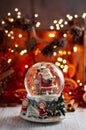 Musical Snow Globe with Santa Claus on bokeh background Royalty Free Stock Photo