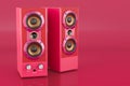 Musical speakers in trending viva magenta colors, 3D rendering