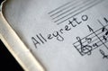 Musical tempo `Allegretto` in a music book