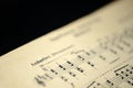 Musical tempo `Andantino` in an old music notebook