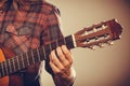 Musicans arm holding strings. Royalty Free Stock Photo