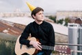 Musician at birthday party. Celebration on roof Royalty Free Stock Photo