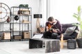 Musician on black couch Royalty Free Stock Photo