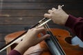 Musician with cello plays the strings with his hands Royalty Free Stock Photo