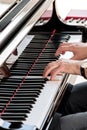 Musician or composer playing grand piano and touching its keys Royalty Free Stock Photo