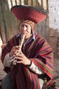 Inca descendent Musician playing flute Chinchero market Cusco Peru UNESCO world heritage city