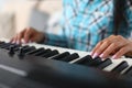 Musician fingers on flat keys synthesizer surface Royalty Free Stock Photo