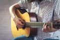 Musician girl playing acoustic guitar