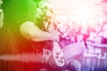 Musician guitarist with overlay colorful effect for music entertainment event on stage show background