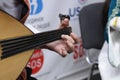 musician hand playing Turkic chordophone musical instrument baglama