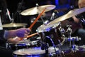 Musician hands holding drumsticks playing drums marching cymbals, closeup Royalty Free Stock Photo