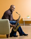 Musician holding saxophone