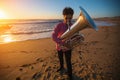 Musician instrumentalist playing the Tuba on the sea coast. Hobby. Royalty Free Stock Photo