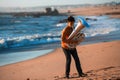 Lone musician instrumentalist playing the Tuba on the sea coast.