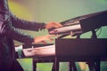 Musician, keyboard synthesizer and hands at stage playing at concert, music festival or live event in Amsterdam. Artist Royalty Free Stock Photo