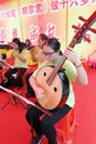 Musician of macau taoist orchestra play yueqin