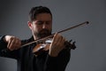 Musician man playing the violin. Musical instrument on performer Royalty Free Stock Photo