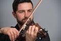 Musician man playing the violin. Musical instrument on performer Royalty Free Stock Photo