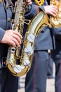 Musician of military orchestra plays his saxophone