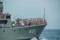 Musician navals with music instruments on navy warship running o