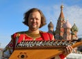 Musician with old Russian music instrument gusli