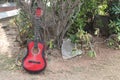 The musician places his red Fender Squier Stratocaster-A beautiful strap for a guitar made of genuine leather Royalty Free Stock Photo