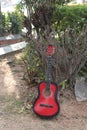 The musician places his red Fender Squier Stratocaster-A beautiful strap for a guitar made of genuine leather Royalty Free Stock Photo