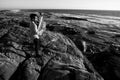 A musician play jazz a tuba on the seashore. Black and white photo Royalty Free Stock Photo