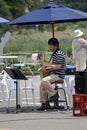 The musician play the saxophone in the garden To give pleasure Entertainment for the people