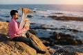 Musician play to musical instrument Tuba on romantic sea shore. Hobby.