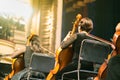 Musician play violin. Female violinist playing the violin stringst on the concert stage. Closeup.