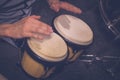 Musician playing bongos