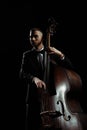 Musician playing on contrabass isolated on Royalty Free Stock Photo