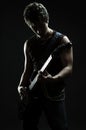 Musician playing in the darkness Royalty Free Stock Photo