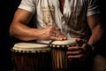 Musician playing a djembe drum. Drummer with djembe. Concept of musical passion, rhythm, cultural music, and artistic