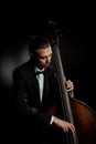 Musician playing on double bass on Royalty Free Stock Photo