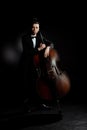 Musician playing on double bass on Royalty Free Stock Photo
