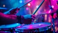 Musician playing drums on stage with colorful background