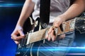 Musician playing electric guitar with mediator Royalty Free Stock Photo