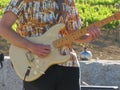 A musician playing the guitar composing beautiful songs