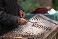 Musician playing hammered dulcimer with mallets