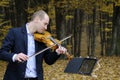 Musician playing at instrument