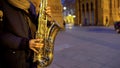 Musician playing saxophone music, nice romantic atmosphere, date in night city