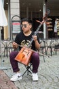 musician playing traditional Mongolian violin in the street