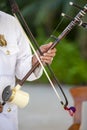 Musician playing a Tro at a Cambodian Wedding Ceremony