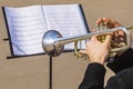 Musician playing the trumpet on notes Royalty Free Stock Photo